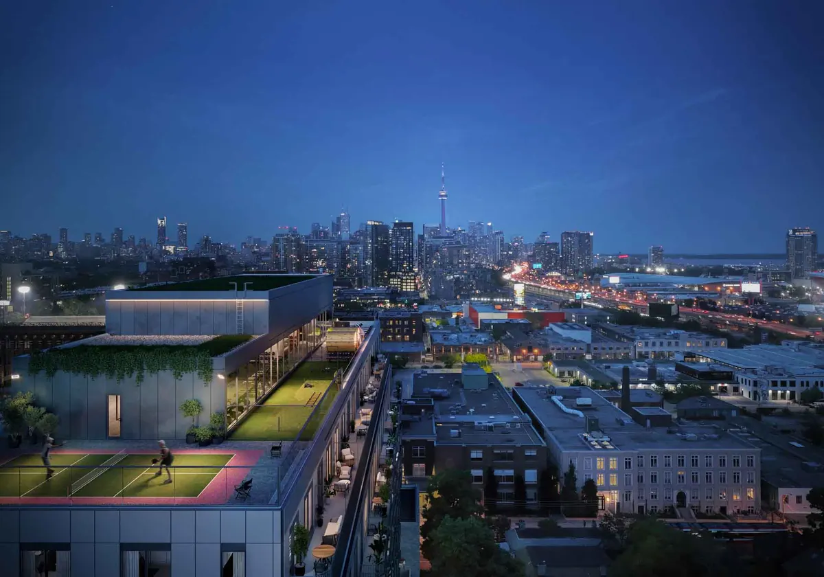 Artist's concept of the rooftop pickleball court at dusk with the downtown skyline beyond